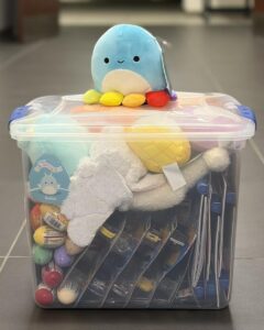 Toy case filled with comfort items in a courthouse hallway